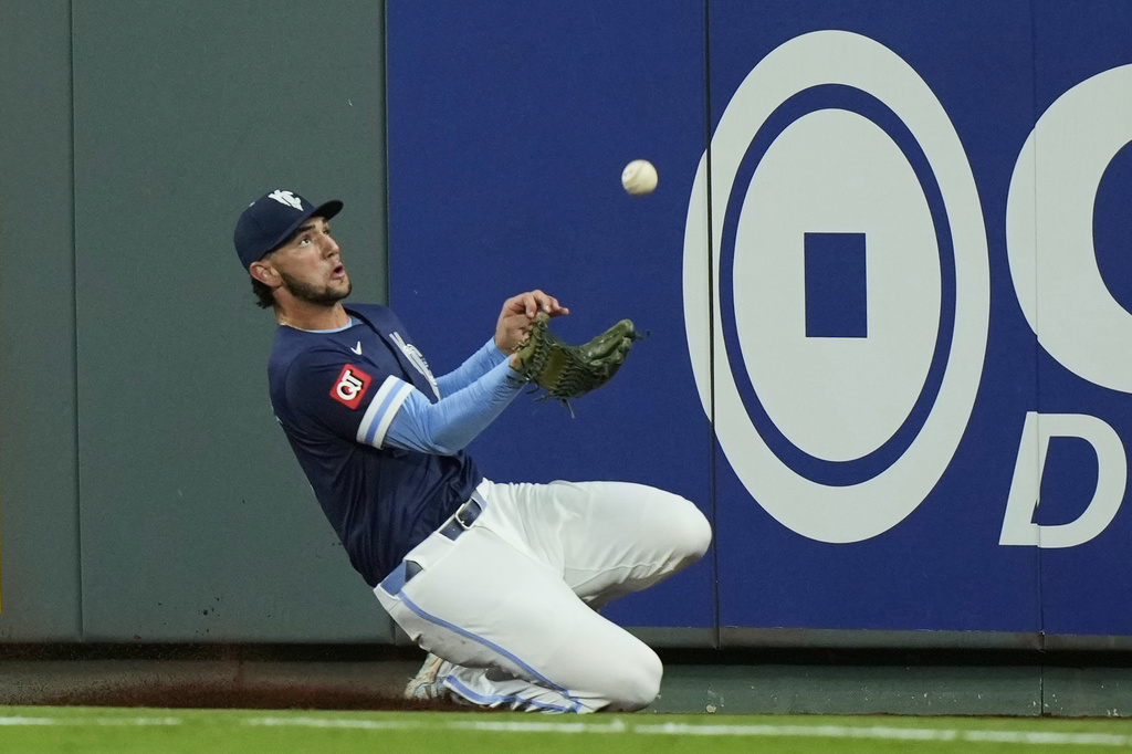 Kansas City Royals right fielder Jack Cagliaone catches a fly foul ball for the out 0n Minnesota Twins' Byron Buxton during the fifth inning of a baseball game Friday, Sept. 5, 2025, in Kansas City, Mo. (AP Photo/Charlie Riedel)