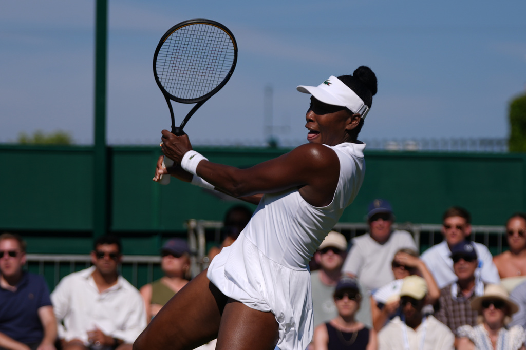 Venus Williams of the United States plays a return during the first round mixed doubles match with her partner Kevin Krawietz of Germany against Lloyd Glasspool of Britain and Tereza Mihalikova of Slovakia at the Wimbledon Tennis Championships in London, Friday, July 3, 2026.(AP Photo/Maja Smiejkowska)