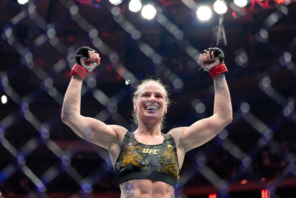 Kyrgyzstan's Valentina Shevchenko celebrates after defeating China's Zhang Weili during a women's flyweight title bout at a UFC 322 mixed martial arts event, Saturday, Nov. 15, 2025, in New York. (AP Photo/Yuki Iwamura)