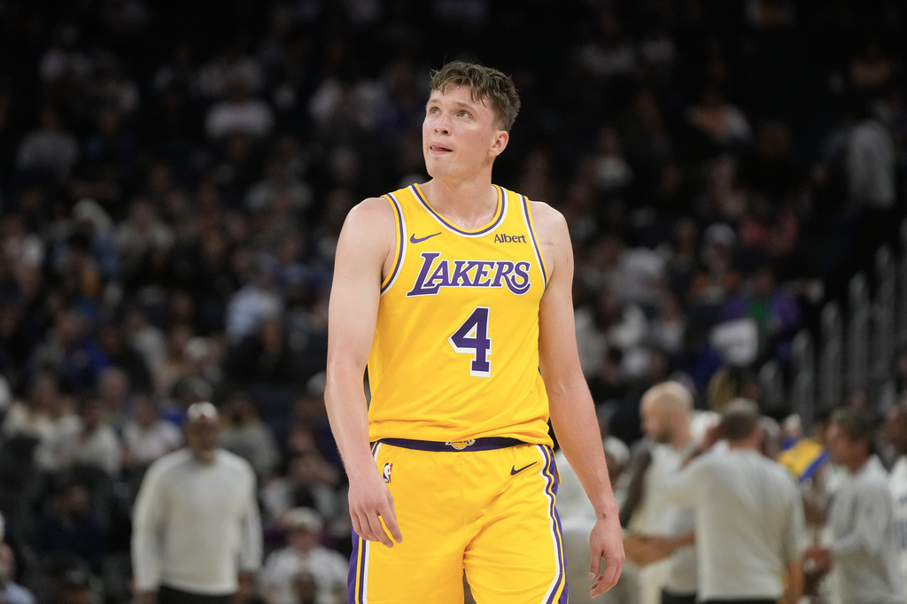 Los Angeles Lakers forward Dalton Knecht (4) walks toward the bench during the second half of an NBA preseason basketball game against the Golden State Warriors, Tuesday, Oct. 6, 2026, in San Francisco. (AP Photo/Jeff Chiu)