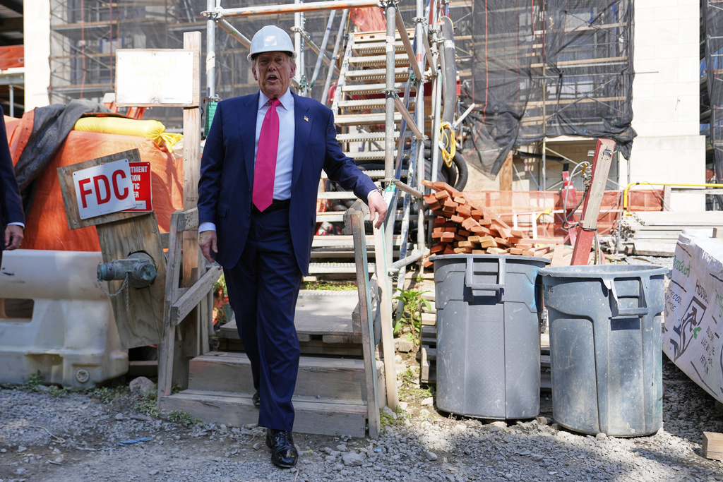 FILE - President Donald Trump visits the Federal Reserve during renovations, July 24, 2025, in Washington. (AP Photo/Julia Demaree Nikhinson)