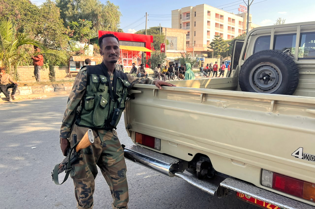 Tigray Peace Force fighters stand in a road after entering Mekelle, in Ethiopia's Tigray region, Sunday, Oct. 4, 2026. (AP Photo/Filmon Equar Hailu)