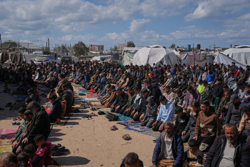 Muslim worshippers perform Friday prayers during the holy month of Ramadan outside the destroyed Al-Albani Mosque, in Khan Younis, southern Gaza Strip, Friday, Feb. 27, 2026. (AP Photo/Abdel Kareem Hana)