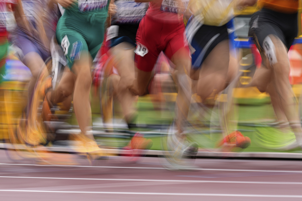 Runners compete in a men's 1,500 meters heat at the World Athletics Championships in Tokyo, Sunday, Sept. 14, 2025. (AP Photo/Petr David Josek)