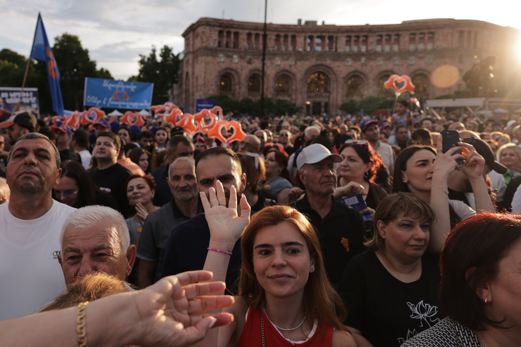 Supporters of Armenia's ruling Civil Contract party led by Prime Minister Nikol Pashinyan gather in Republic Square in Yerevan, Armenia, Friday, June 5, 2026, for the party's final campaign rally ahead of the upcoming parliamentary elections. (AP Photo/Anthony Pizzoferrato)