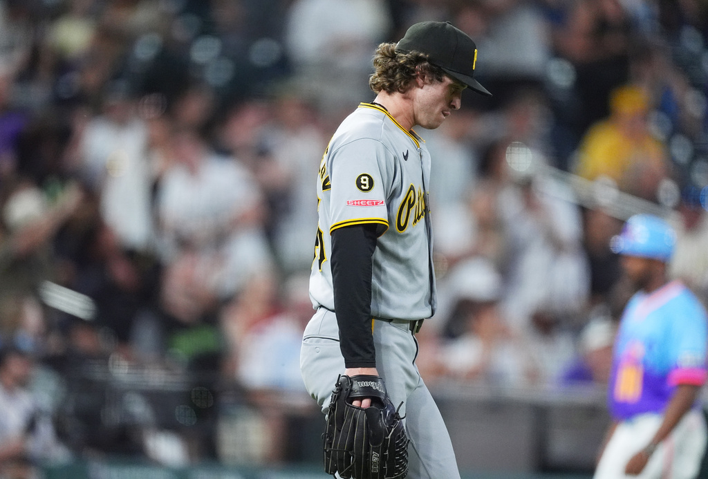 Pittsburgh Pirates relief pitcher Mason Montgomery reacts after giving up a two-run double to Colorado Rockies pinch hitter Braxton Fulford in the eighth inning of a baseball game Friday, June 19, 2026, in Denver. (AP Photo/David Zalubowski)