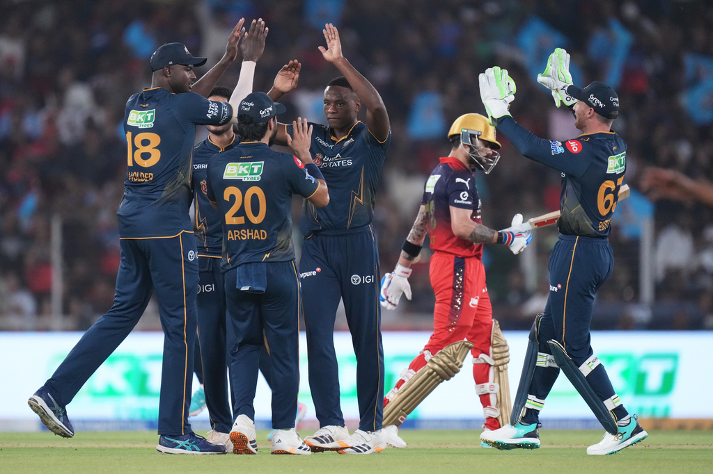 Gujarat Titans' Kagiso Rabada celebrate with teammates the wicket of Royal Challengers Bengaluru's Virat Kohli during the Indian Premier League cricket match between Gujarat Titans and Royal Challengers Bengaluru in Ahmedabad, India, Thursday, April 30, 2026. (AP Photo/Ajit Solanki)