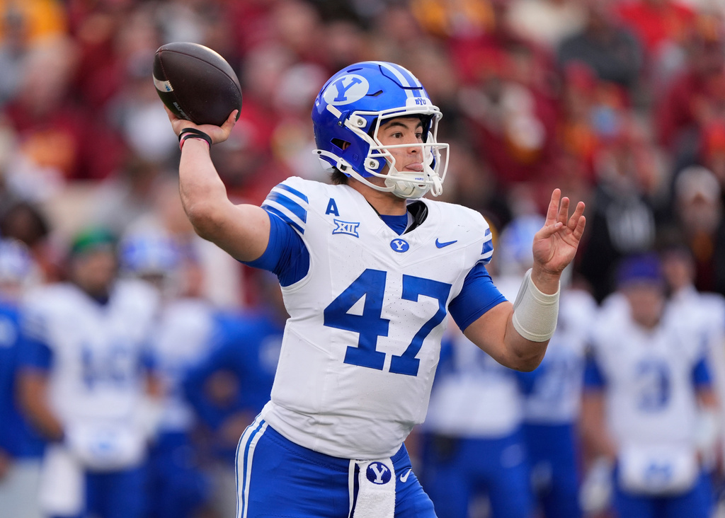 BYU quarterback Bear Bachmeier sends a pass downfield against Iowa State during the first half of an NCAA college football game, Saturday, Oct. 25, 2025, in Ames, Iowa. (AP Photo/Matthew Putney)