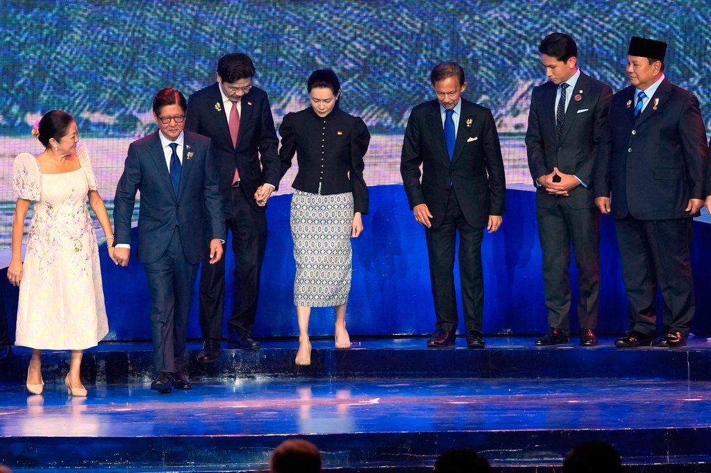 From left, Philippines first lady Maria Louise Marcos, Philippine President Ferdinand Marcos Jr., Singapore's Prime Minister Lawrence Wong, his wife Loo Tze Lui, Brunei's Sultan Hassanal Bolkiah, his son Prince Abdul Mateen and Indonesia's President Prabowo Subianto leave the stage after a group photo during the opening ceremony of the 48th ASEAN Summit and Related Meetings in Cebu, Philippines on Friday, May 8, 2026. (AP Photo/Aaron Favila, Pool)