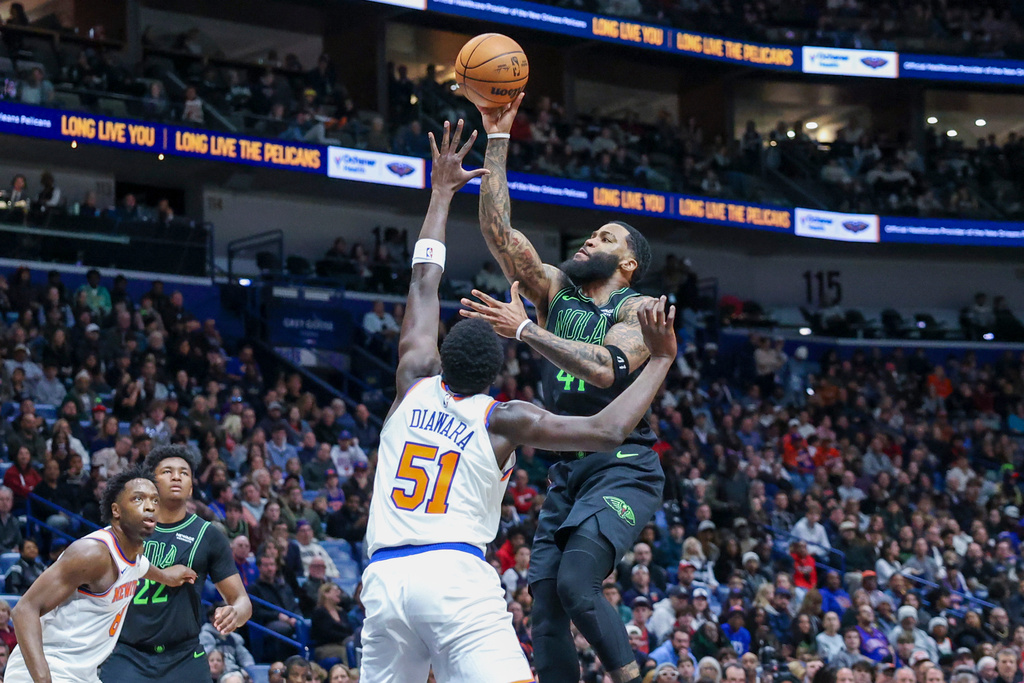 New Orleans Pelicans guard Saddiq Bey (41) goes up to shoot a one-handed jumper over New York Knicks forward Mohamed Diawara (51) in the first half of an NBA basketball game in New Orleans, Monday, Dec. 29, 2025. (AP Photo/Peter Forest)