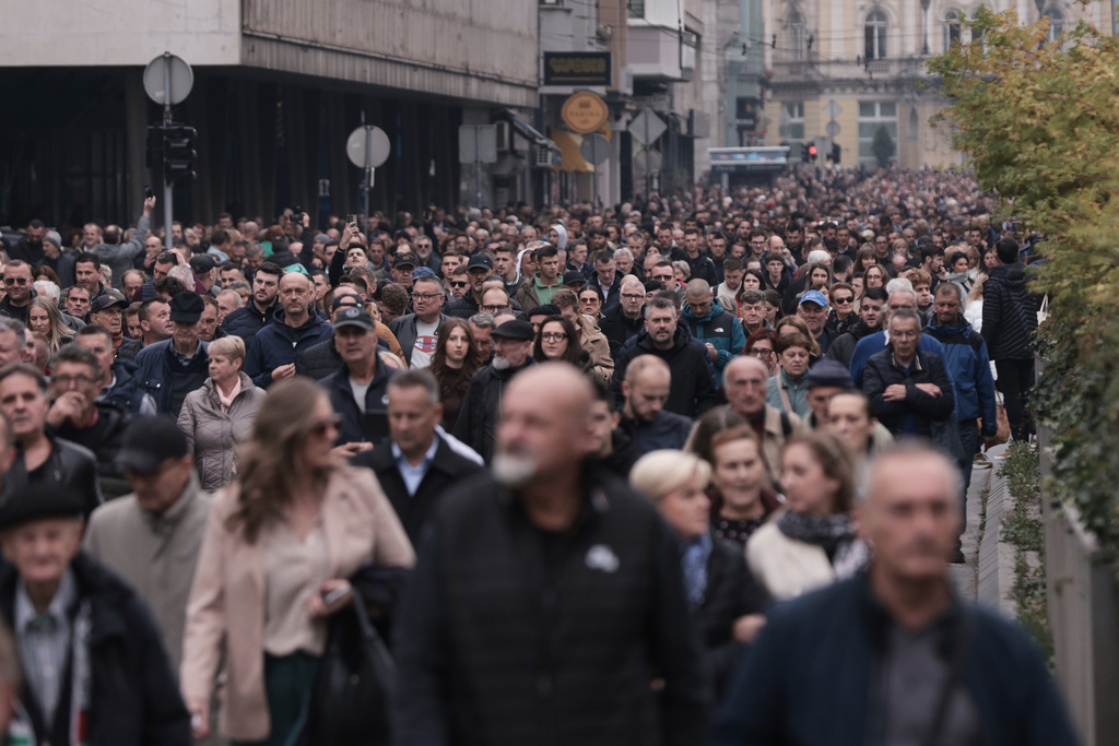 Thousands of people attend the funeral of popular Bosnian folk singer Halid Beslic, who also was also widely known for his humanitarian work during and after the country's bloody 1992-95 war, in Sarajevo, Bosnia, Monday, Oct. 13, 2025. (AP Photo/Armin Durgut)