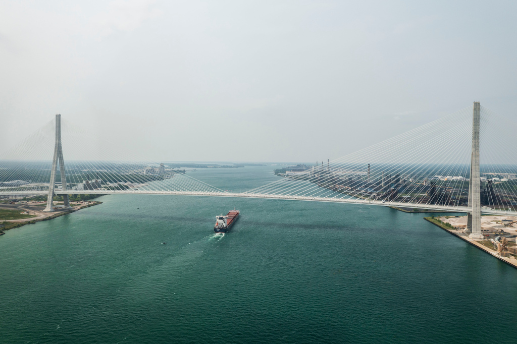 The Canadian bulk freighter G3 Marquis passes under the Gordie Howe International Bridge between Detroit, Mich. and Windsor, Ontario on its opening day, Monday, July 27 2026. (Jacob Hamilton/Ann Arbor News via AP)