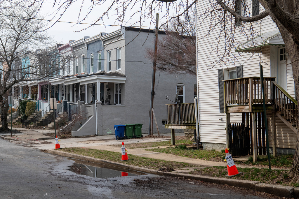 Cones sit near an area of Baltimore that previously suffered a sewage backup on March 5, 2026. (AP Photo/Michael Phillis)