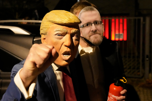 A person wearing a Donald Trump costume for a Halloween party gestures in Warsaw, Poland, Friday, Oct. 31, 2025. (AP Photo/Czarek Sokolowski) A person wearing a Donald Trump costume for a Halloween party gestures in Warsaw, Poland, Friday, Oct. 31, 2025. (AP Photo/Czarek Sokolowski)