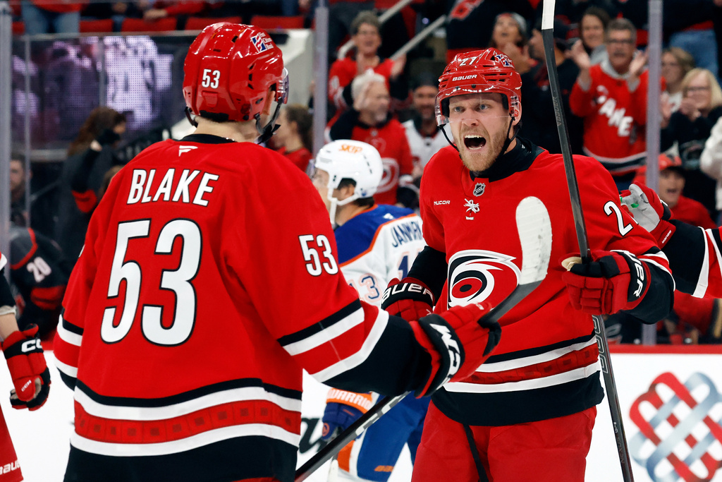 Carolina Hurricanes' Nikolaj Ehlers (27) celebrates his goal with Jackson Blake (53) during the second period of an NHL hockey game against the Edmonton Oilers in Raleigh, N.C., Saturday, Nov. 15, 2025. (AP Photo/Karl DeBlaker)