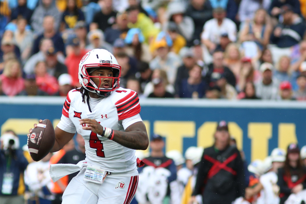 Utah Utes quarterback Devon Dampier (4) makes a pass during the first half of an NCAA college football game against West Virginia Mountaineers, Saturday, Sept, 27, 2025, in Morgantown, W.Va. (AP Photo/ William Wotring)