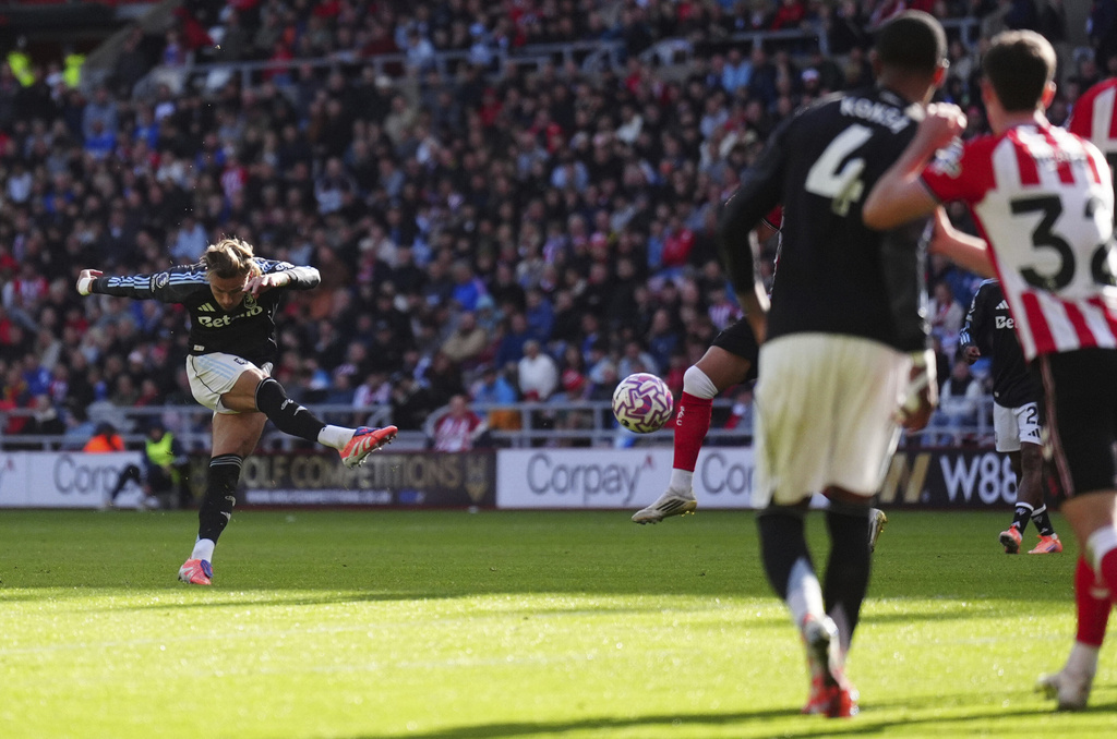 Aston Villa's Matty Cash scores his side's first goal of the game during the English Premier League soccer match between Sunderland and Aston Villa at the Stadium of Light, in Sunderland, England, Sunday Sept. 21, 2025. (Owen Humphreys/PA via AP)