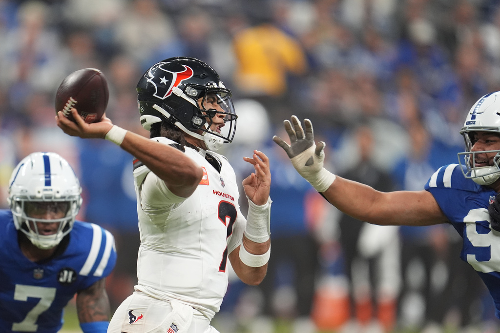 Houston Texans quarterback C.J. Stroud (7) throws a pass against the Indianapolis Colts during the second half of an NFL football game Sunday, Nov. 30, 2025, in Indianapolis. (AP Photo/Michael Conroy)