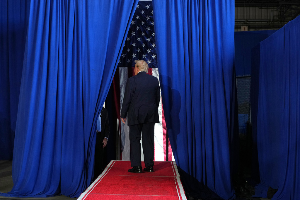 President Donald Trump walks from the state after speaking at a campaign rally at the Port of Corpus Christi, Tuesday, Oct. 27, 2026, in Corpus Christi, Texas. (AP Photo/Alex Brandon)