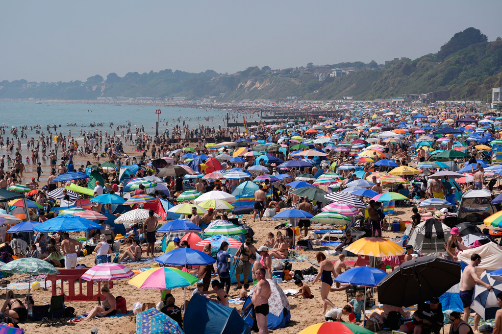 People visit Bournemouth beach, south England, Monday May 25, 2026. (Andrew Matthews/PA via AP)