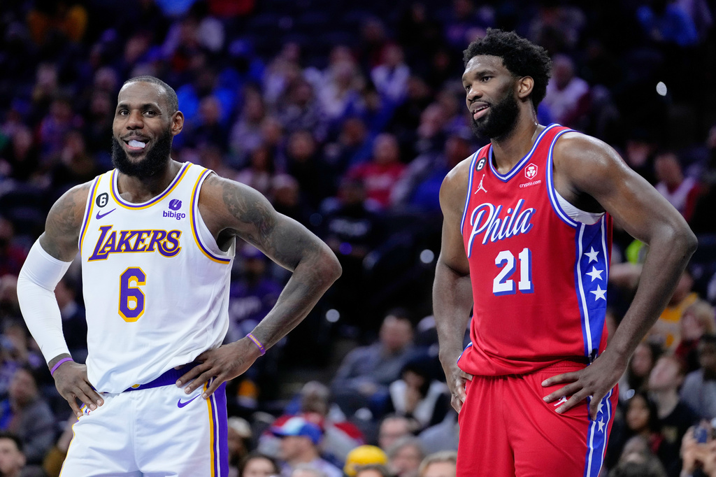 Los Angeles Lakers' LeBron James and Philadelphia 76ers' Joel Embiid play during an NBA basketball game, Friday, Dec. 9, 2022, in Philadelphia. (AP Photo/Matt Slocum, File)