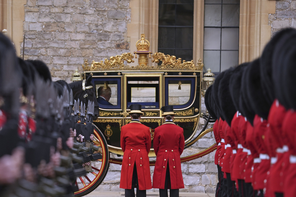 President Donald Trump and Britain's King Charles III arrive in the Irish State Coach during an arrival ceremony at Windsor Castle, in Windsor, England, Wednesday, Sept. 17, 2025. (AP Photo/Evan Vucci)