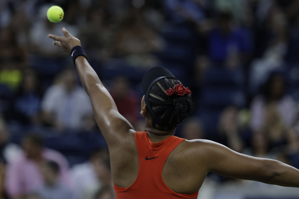Naomi Osaka, of Japan, serves to Greet Minnen, of Belgium, during the first round of the U.S. Open tennis championships, Tuesday, Aug. 26, 2025, in New York. (AP Photo/Adam Hunger)