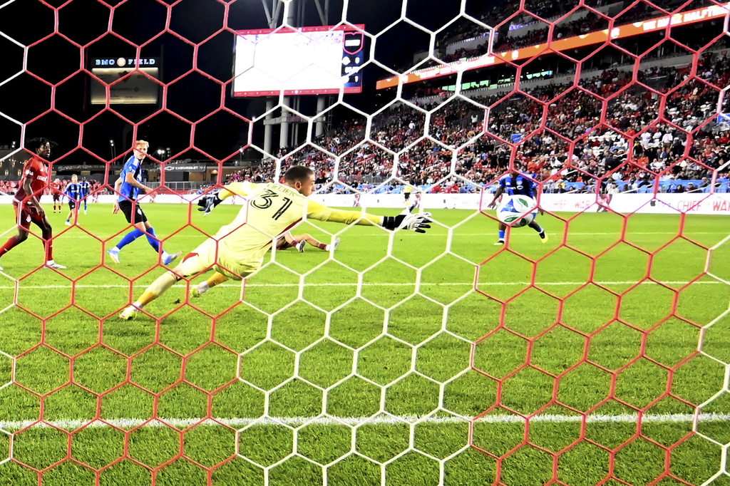 CF Montreal goalkeeper Thomas Gillier is unable to reach the game tying goal from Toronto FC's Jonathan Osorio, not seen, during second half MLS soccer action in Toronto on Saturday, August 30, 2025. (Jon Blacker/The Canadian Press via AP)