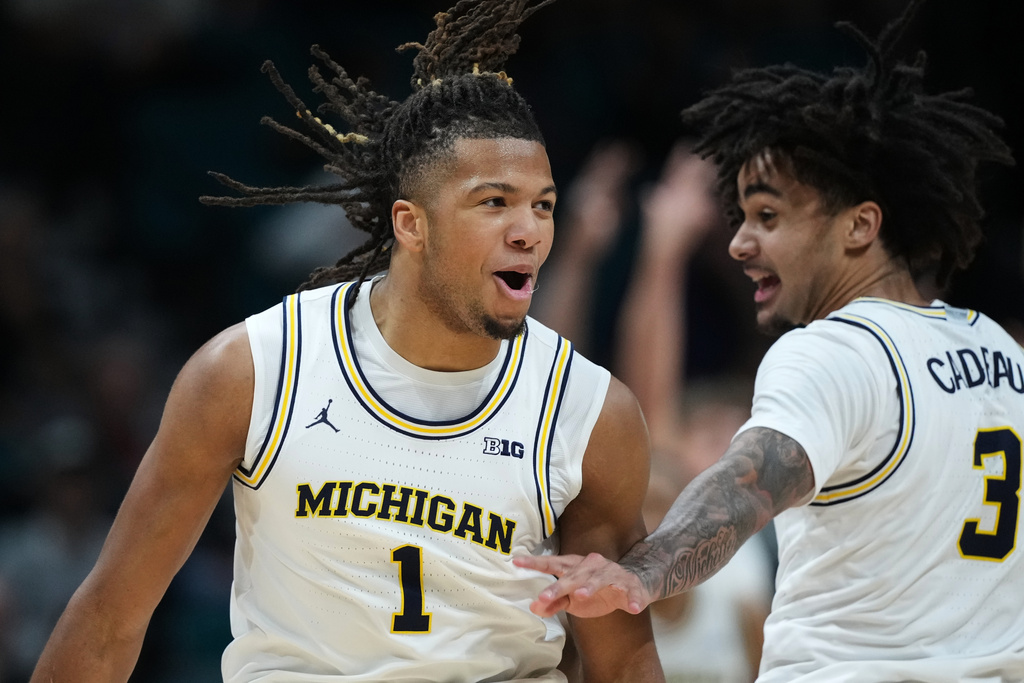 Michigan guard Trey McKenney (1) and guard Elliot Cadeau (3) celebrate a score against Gonzaga during the second half of an NCAA college basketball game in the Players Era tournament in Las Vegas, Wednesday, Nov. 26, 2025. (AP Photo/Eric Gay)