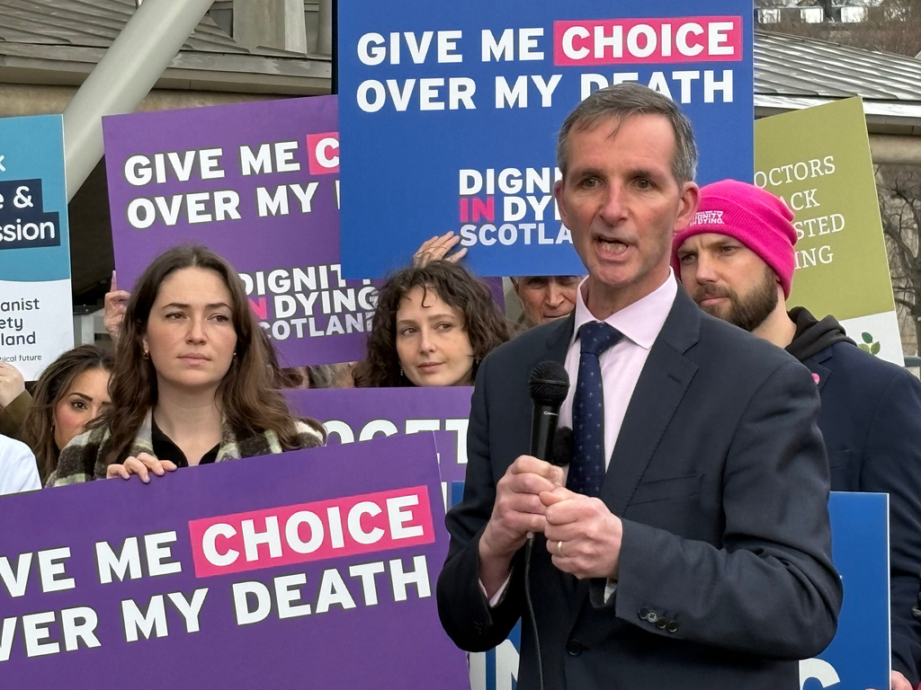 Liberal Democrat lawmaker Liam McArthur joins a rally of supporters ahead of MSPs debating his Assisted Dying for Terminally Ill Adults (Scotland) Bill, in the Scottish Parliament in Edinburgh, Scotland, Tuesday, March 17, 2026. (Neil Pooran/PA via AP)