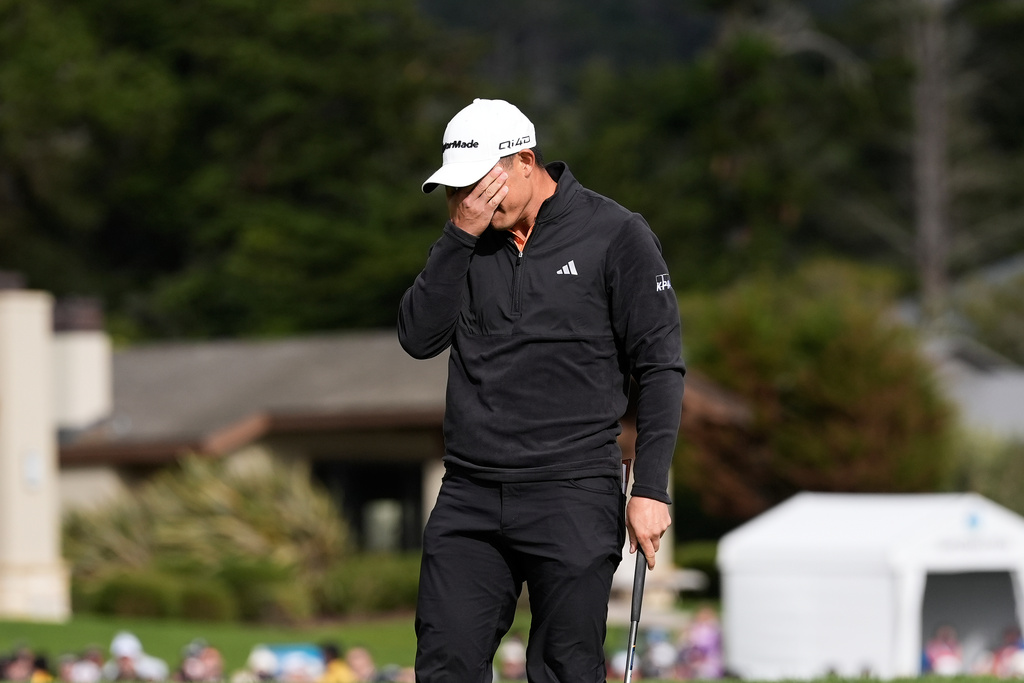 Collin Morikawa reacts after making a birdie putt on the 18th hole at Pebble Beach Golf Links during the final round of the AT&T Pebble Beach Pro-Am golf tournament in Pebble Beach, Calif., Sunday, Feb. 15, 2026. (AP Photo/Godofredo A. Vásquez)