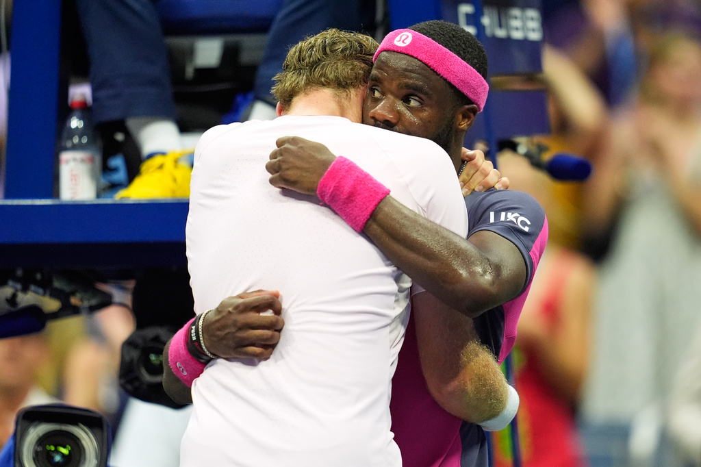 Frances Tiafoe, of the United States, right, and Alex Michelsen, of the United States, embrace after Tiafoe won their match during the quarterfinal round of the U.S. Open tennis championships, Tuesday, Sept. 8, 2026, in New York. (AP Photo/Seth Wenig)