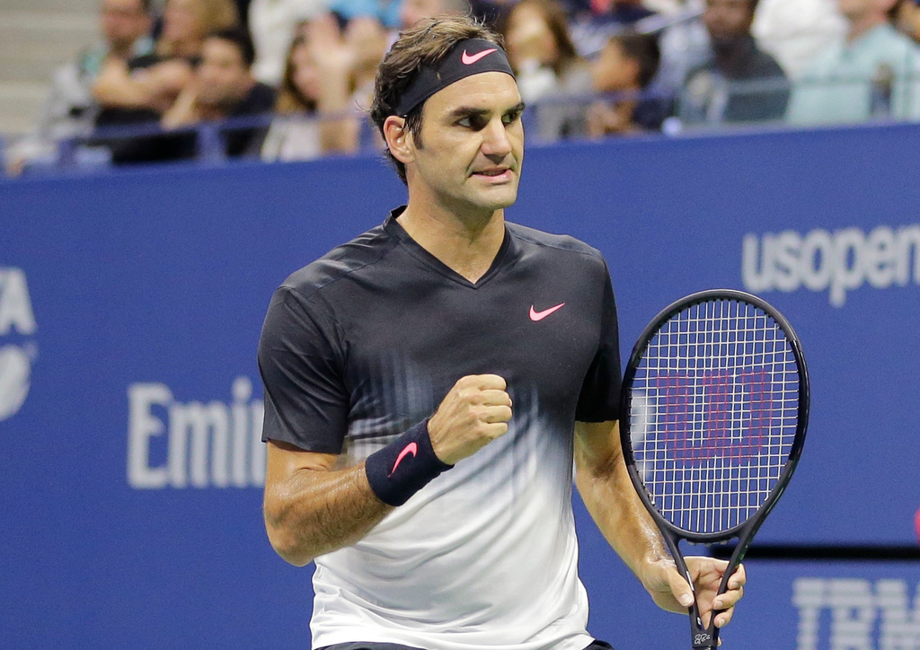 FILE - Roger Federer, of Switzerland, clenches his fist after wining a point against Feliciano Lopez, of Spain, during the U.S. Open tennis tournament in New York, Sept. 2, 2017. (AP Photo/Seth Wenig)