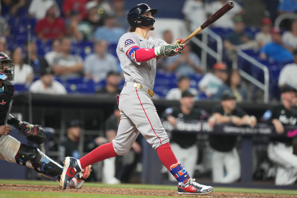 Boston Red Sox's Jarren Duran watches after hitting a grand slam during the 11th inning of a baseball game against the Miami Marlins, Tuesday, Aug. 25, 2026, in Miami. (AP Photo/Lynne Sladky)
