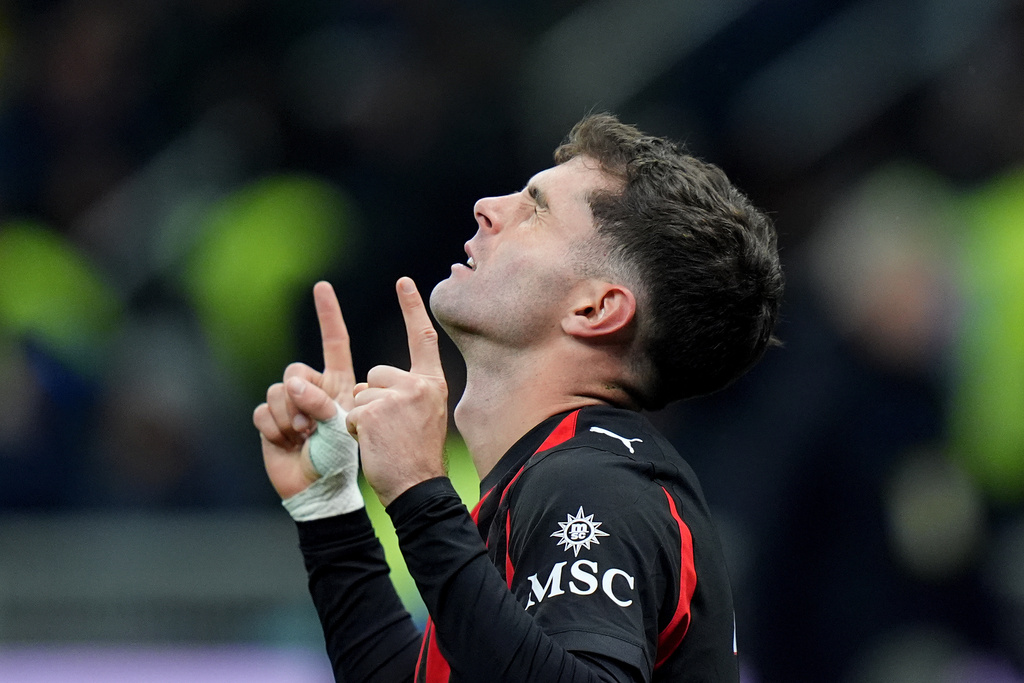 AC Milan's Christian Pulisic celebrates after scoring during the Serie A soccer match between Inter Milan and AC Milan in Milan, Italy, Sunday, Nov. 23, 2025. (Spada/LaPresse via AP)