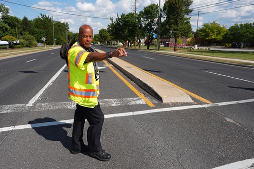 School crossing guard Anthony Taylor directs students on when to cross the street, Wednesday, Sept. 3, 2025, in Indianapolis. (AP Photo/Darron Cummings) School crossing guard Anthony Taylor directs students on when to cross the street, Wednesday, Sept. 3, 2025, in Indianapolis. (AP Photo/Darron Cummings)