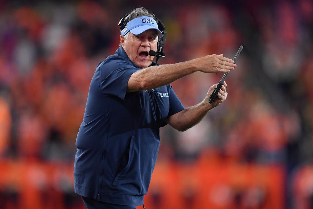 North Carolina head coach Bill Belichick calls a timeout during the first half of an NCAA college football game against Syracuse, Friday, Oct. 31, 2025, in Syracuse, N.Y. (AP Photo/Adrian Kraus)
