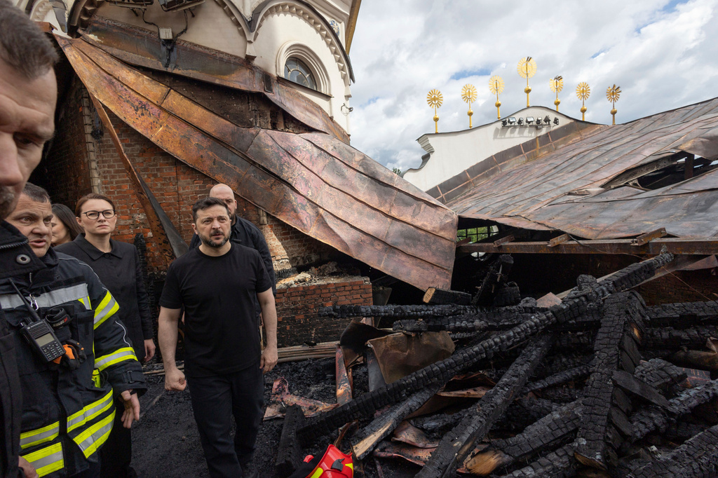 Accompanied by Ukrainian Prime Minister Yulia Svyrydenko, center, left, and Interior Minister Ihor Klymenko, President Volodymyr Zelenskyy, center, enters the Dormition Cathedral of the Kyiv-Pechersk Lavra, which was damaged in an overnight drone attack in Kyiv, Ukraine, Monday, June 15, 2026.