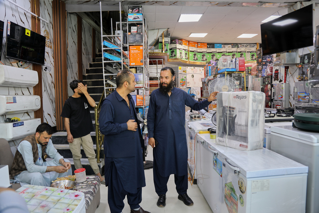Mohammad Murtaza Ishaqzai, sells electronics in his shop in Kabul, Afghanistan, Wednesday, May 13, 2026. (AP Photo/Siddiqullah Alizai)