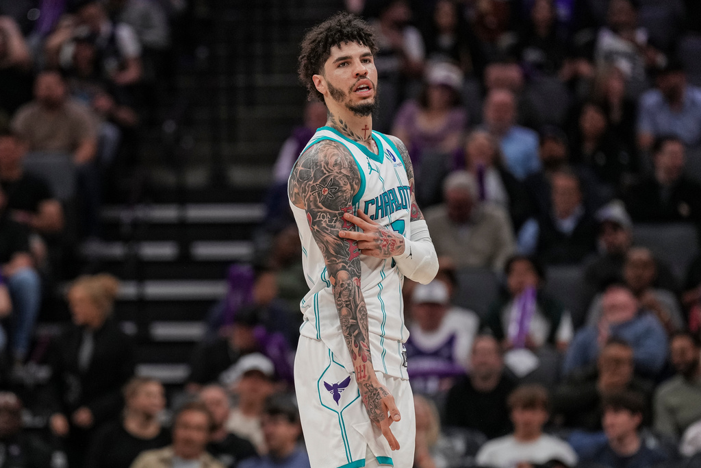 Charlotte Hornets guard LaMelo Ball (1) reacts after a three-point basket during the second half of an NBA basketball game against the Sacramento Kings, Wednesday, March 11, 2026, in Sacramento, Calif. (AP Photo/Justine Willard)
