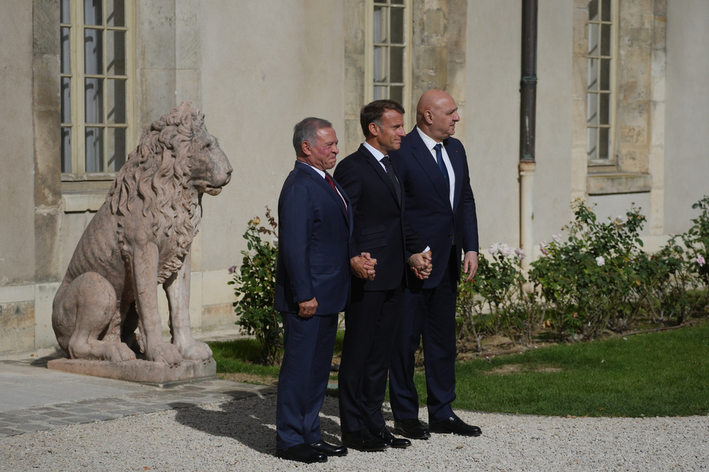 French President Emmanuel Macron, center, Jordan's King Abdullah II, left, and Lebanese President Joseph Aoun pose before a meeting at the Hotel des Invalides in Paris, Thursday Sept. 17, 2026. (AP Photo/Thibault Camus)