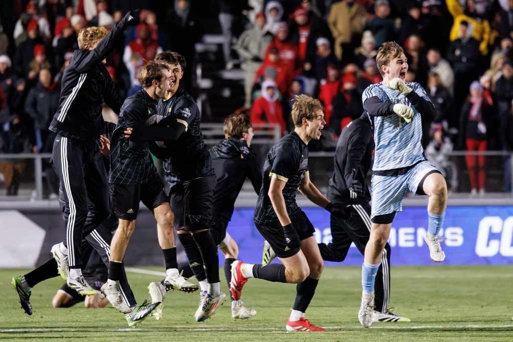 Washington players celebrates after defeating North Carolina State to win the NCAA College Cup National Championship soccer final in Cary, N.C., Monday, Dec. 15, 2025. (AP Photo/Ben McKeown)
