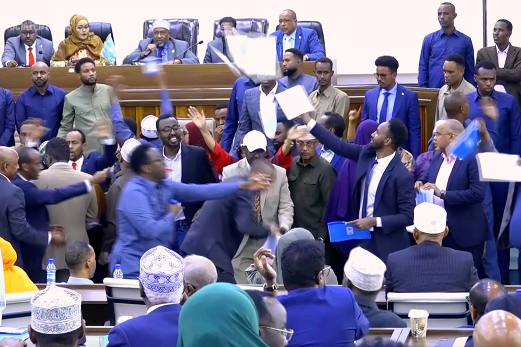 This image taken from an Associated Press video shows a scuffle between lawmakers during a joint session of Somalia's parliament Wednesday, Jan. 28, 2026, in Mogadishu, Somalia. (AP Photo/Mohamud Hassan)