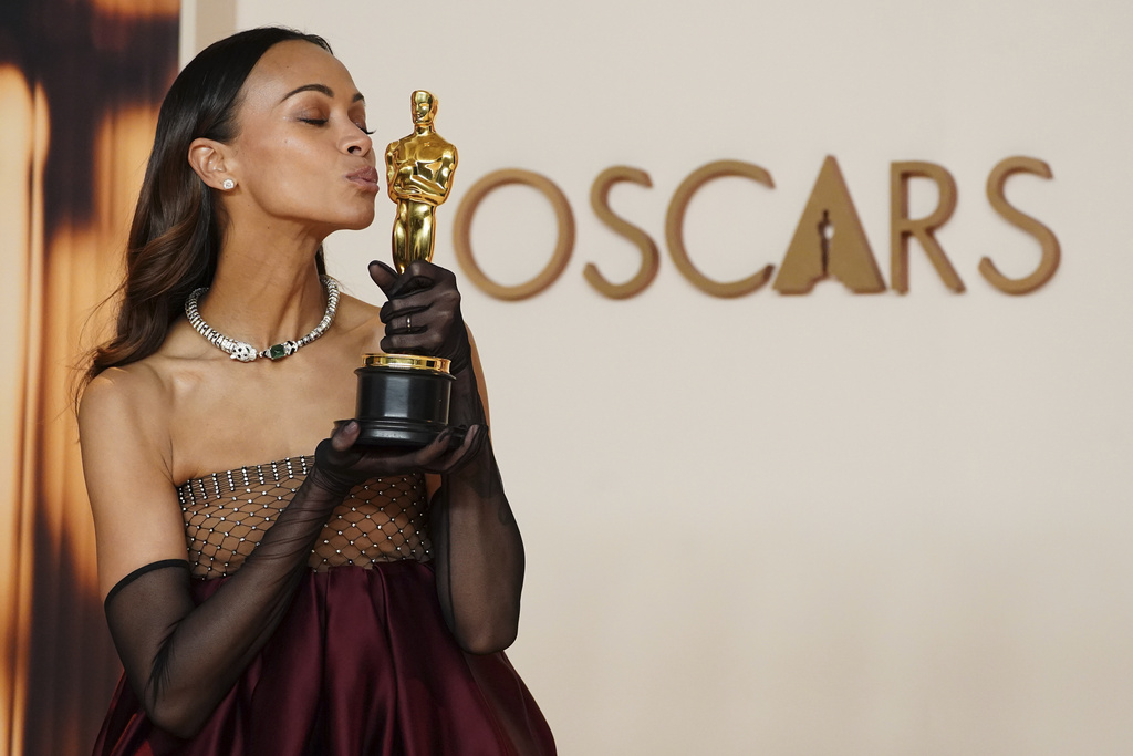 FILE - Zoe Saldana, winner of the award for best performance by an actress in a supporting role for "Emilia Perez," poses in the press room at the Oscars on March 2, 2025, in Los Angeles. (Photo by Jordan Strauss/Invision/AP, File)