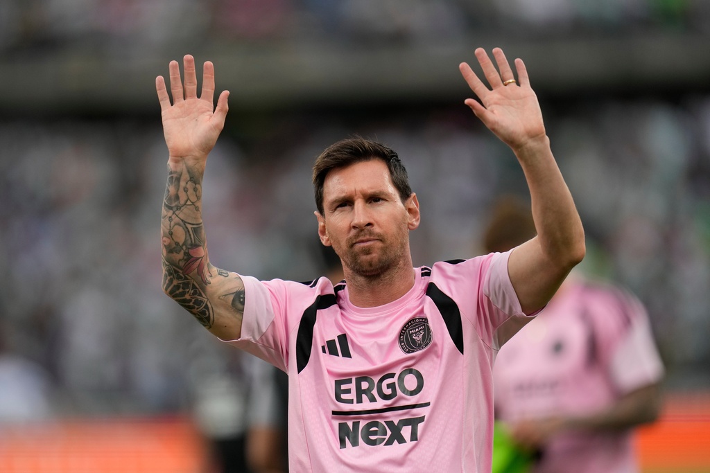 Inter Miami's Lionel Messi acknowledges fans before the start of an international friendly soccer match against Colombia's Atletico Nacional in Medellin, Colombia, Saturday, Jan. 31, 2026. (AP Photo/Fernando Vergara)