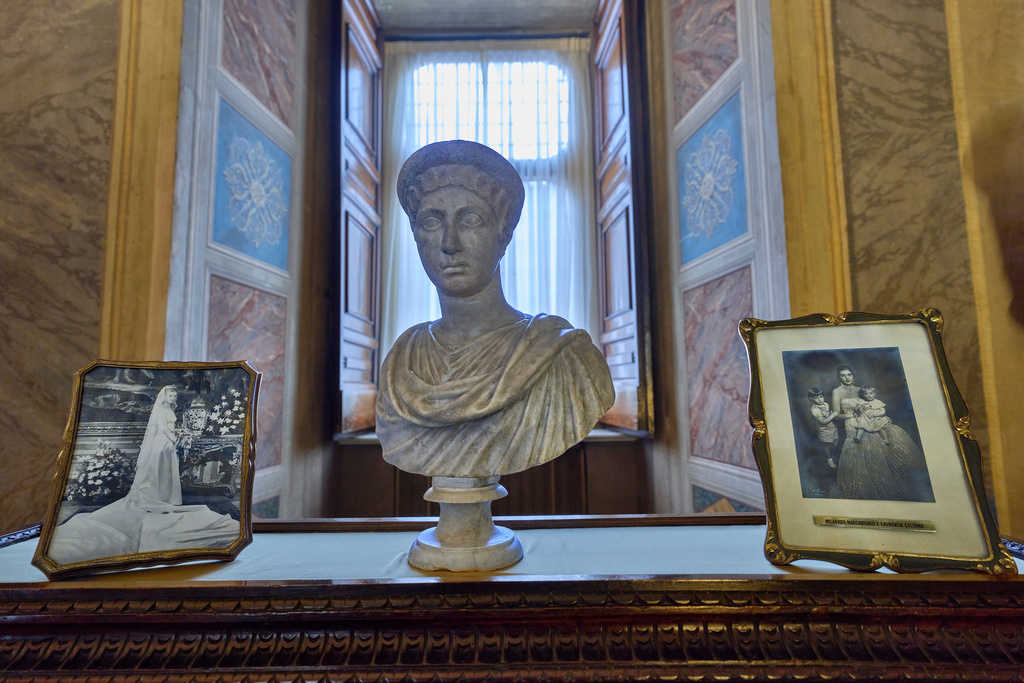 A photograph, right, of Milagros, Marcantonio and Laurentia Colonna is on display inside the prince's apartments at Palazzo Colonna, or the Colonna Palace, in Rome during a media tour, Friday, Nov. 7, 2025. (AP Photo/Domenico Stinellis)