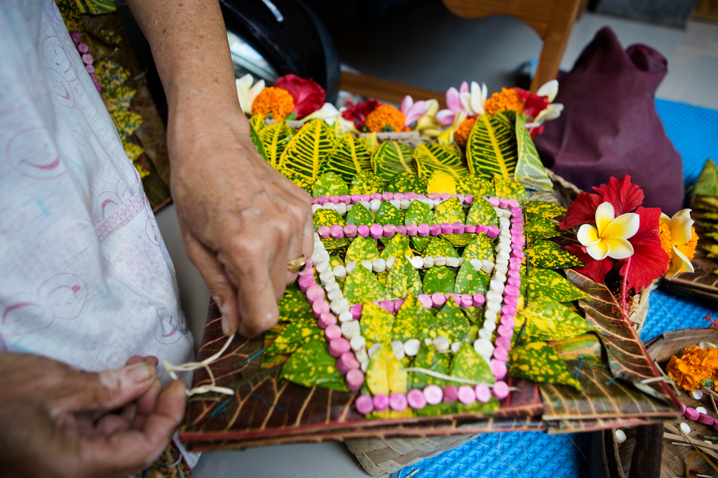 A headwear is prepared for a dancer to perform the sacred Rejang dance during Kuningan holiday, which marks the end of the 10-day Galungan festival celebrating the victory of good over evil, in Karangasem, Bali, Indonesia, Saturday, June 27, 2026. (AP Photo/Firdia Lisnawati)