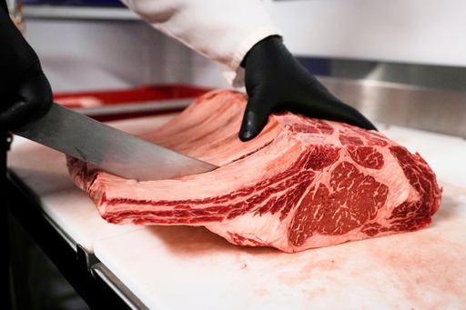 FILE - Raul Rubero, lead butcher at Deep Cuts butcher shop cuts single portions of bone-in steaks as he breaks down a side of beef, Wednesday, Aug. 27, 2025, in Dallas. (AP Photo/Tony Gutierrez, File) FILE - Raul Rubero, lead butcher at Deep Cuts butcher shop cuts single portions of bone-in steaks as he breaks down a side of beef, Wednesday, Aug. 27, 2025, in Dallas. (AP Photo/Tony Gutierrez, File)
