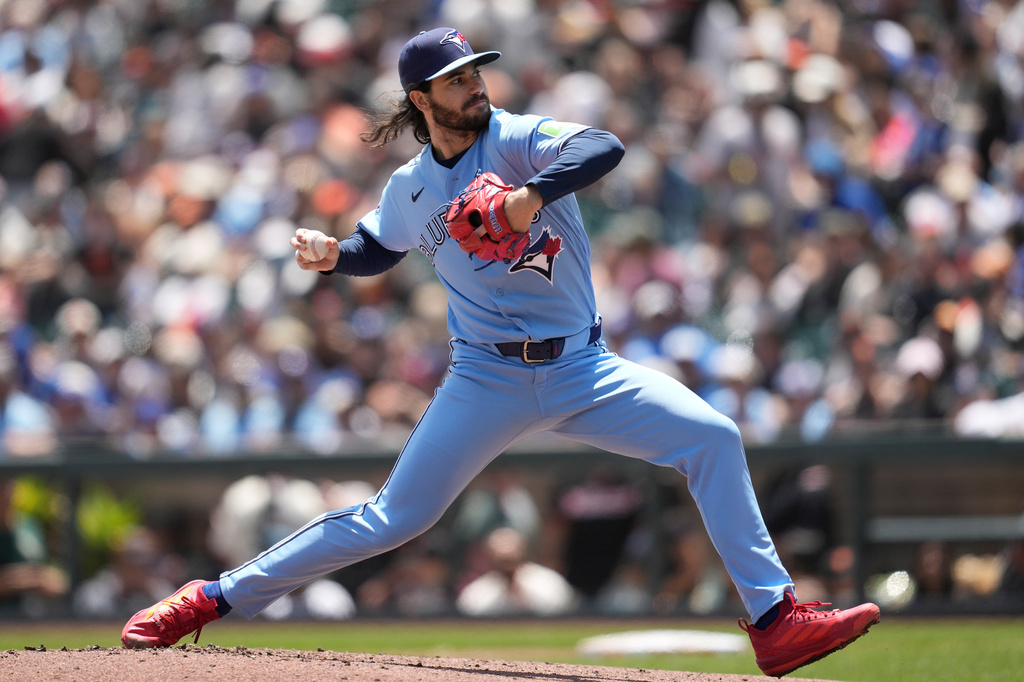 Toronto Blue Jays pitcher Dylan Cease throws against the San Francisco Giants during the first inning of a baseball game Wednesday, July 8, 2026, in San Francisco. (AP Photo/Jeff Chiu)