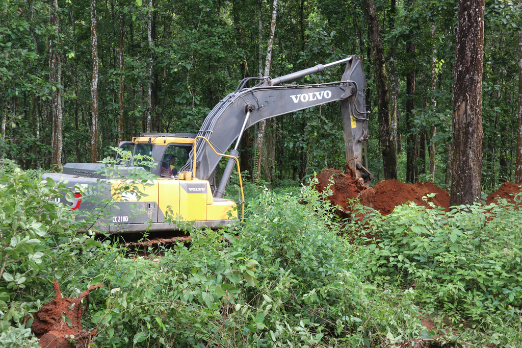 An earthmover digs a burial site for a mass burial of flash floods victims, in Chitwan, Nepal, Saturday, Aug. 29, 2026. (AP Photo/Nisha Shrestha)